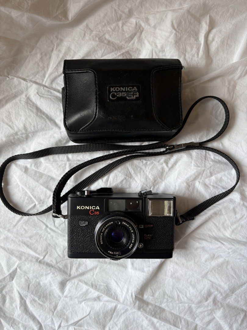 Konica C35 EF Film Camera (Category: Cameras) located in Pasig City. Submitted by parall3lles3m (Listing ID 1464281292, Image 1). Description: Konica C35 EF With sample pics! Flash working Please see images on film door Inclusions: Original pouch and lens cap MOP: BDO BPI Gcash Maribank Shipping from Pasig City.