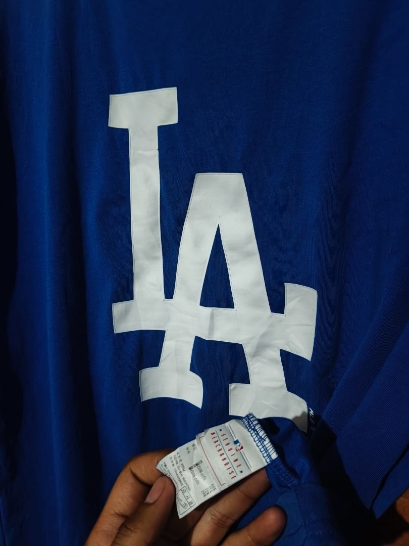 LA Dodgers MLB Blue T-Shirt (Category: Tshirts & Polo Shirts ) located in Cotabato. Submitted by grandwolf-98e8 (Listing ID 1464277305, Image 3). Description: - Official MLB LA Dodgers Blue T-Shirt - Features the iconic 'LA' graphic on the front - Comfortable and casual wear - Ideal for any baseball fan - Great for everyday use.