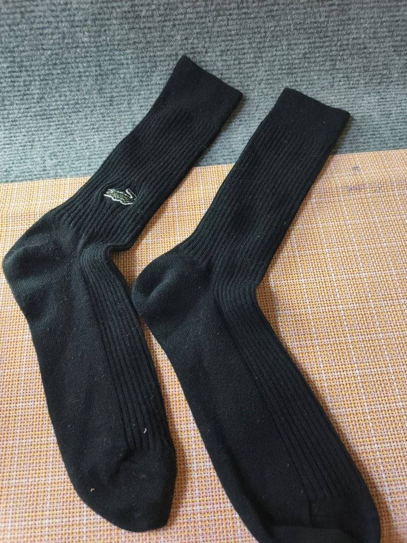 Lacoste Black Ribbed Socks with Crocodile Logo (Category: Socks) located in San Leonardo. Submitted by burgossanleonardo.12345 (Listing ID 1464188468, Image 1). Description: - Classic black ribbed socks from Lacoste. - Features the iconic embroidered green crocodile logo. - Comfortable and stylish for everyday wear. - Good length for casual or athletic use. - A wardrobe staple..