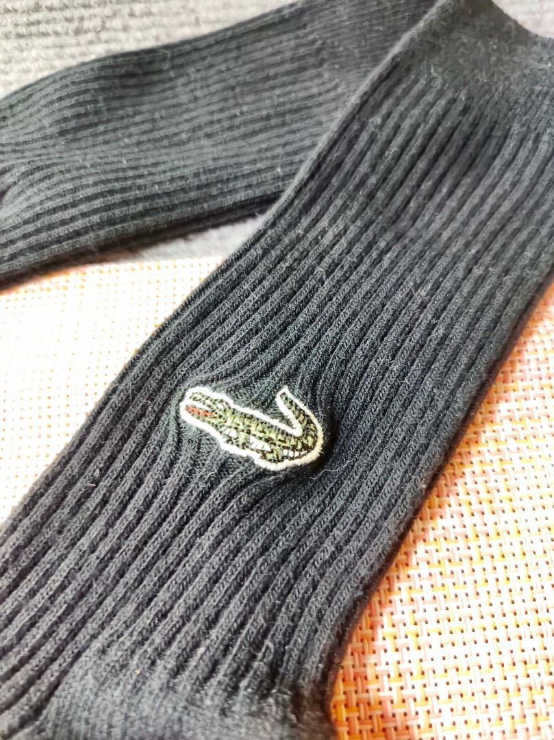 Lacoste Black Ribbed Socks with Crocodile Logo (Category: Socks) located in San Leonardo. Submitted by burgossanleonardo.12345 (Listing ID 1464188468, Image 3). Description: - Classic black ribbed socks from Lacoste. - Features the iconic embroidered green crocodile logo. - Comfortable and stylish for everyday wear. - Good length for casual or athletic use. - A wardrobe staple..