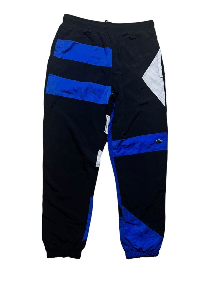LACOSTE MENS PATCHWORK WATER PROOF NYLON CUFF PANTS (Category: Joggers) located in Las Pinas. Submitted by greedythrifterz (Listing ID 1464284752, Image 3). Description: LACOSTE MENS PATCHWORK WATER PROOF NYLON CUFF PANTS DIMES- WIDTH 30-36, LENGTH 41, THIGHS 14 (ALL INCHES) NEEDWASH ONLY, FREE SHIP AND NEGOTIABLE .
