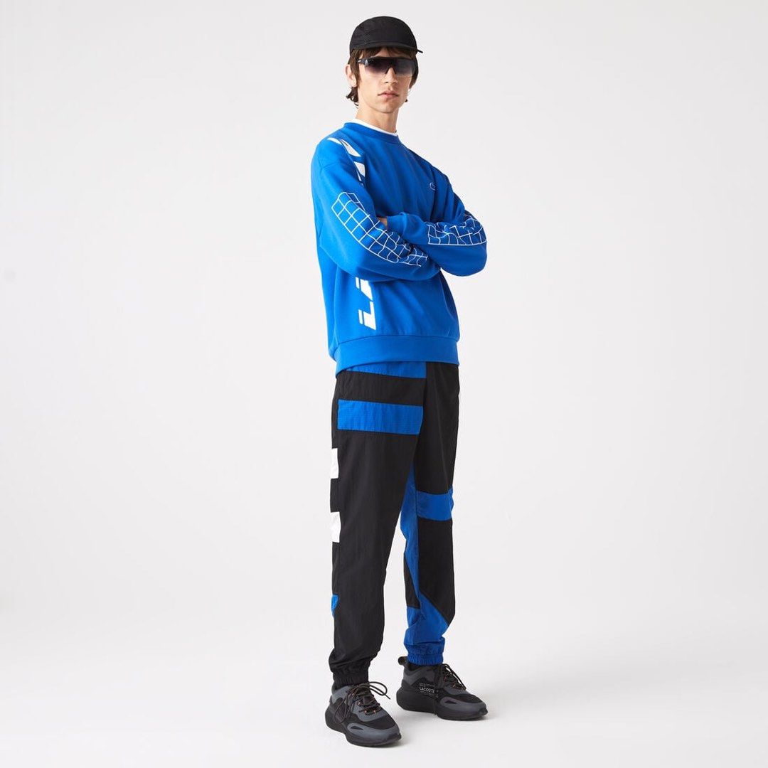 LACOSTE MENS PATCHWORK WATER PROOF NYLON CUFF PANTS (Category: Joggers) located in Las Pinas. Submitted by greedythrifterz (Listing ID 1464284752, Image 2). Description: LACOSTE MENS PATCHWORK WATER PROOF NYLON CUFF PANTS DIMES- WIDTH 30-36, LENGTH 41, THIGHS 14 (ALL INCHES) NEEDWASH ONLY, FREE SHIP AND NEGOTIABLE .