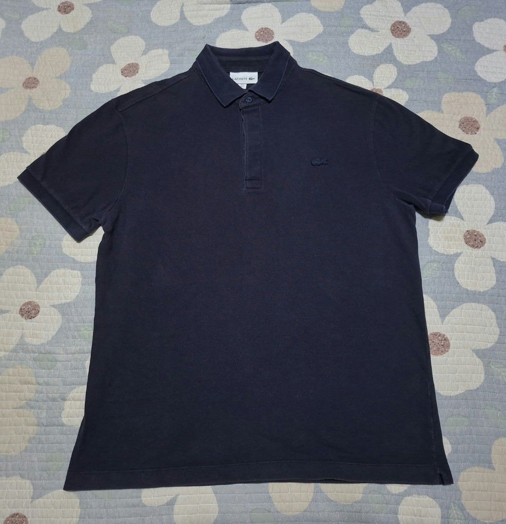 Lacoste Navy Blue Polo Shirt (Category: Tshirts & Polo Shirts ) located in Agdangan. Submitted by jrmygrrr (Listing ID 1464253185, Image 1). Description: Dimes: 21x27 Size 5 in tag Good as new No issues.
