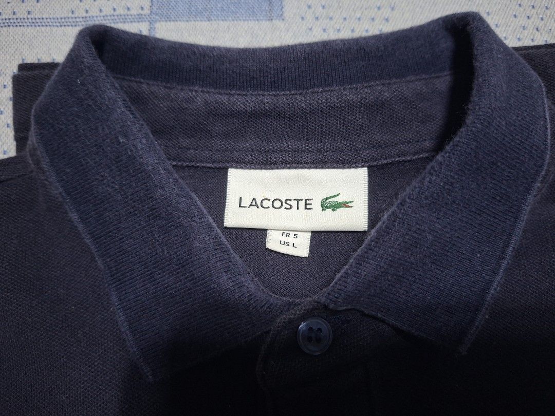 Lacoste Navy Blue Polo Shirt (Category: Tshirts & Polo Shirts ) located in Agdangan. Submitted by jrmygrrr (Listing ID 1464253185, Image 2). Description: Dimes: 21x27 Size 5 in tag Good as new No issues.
