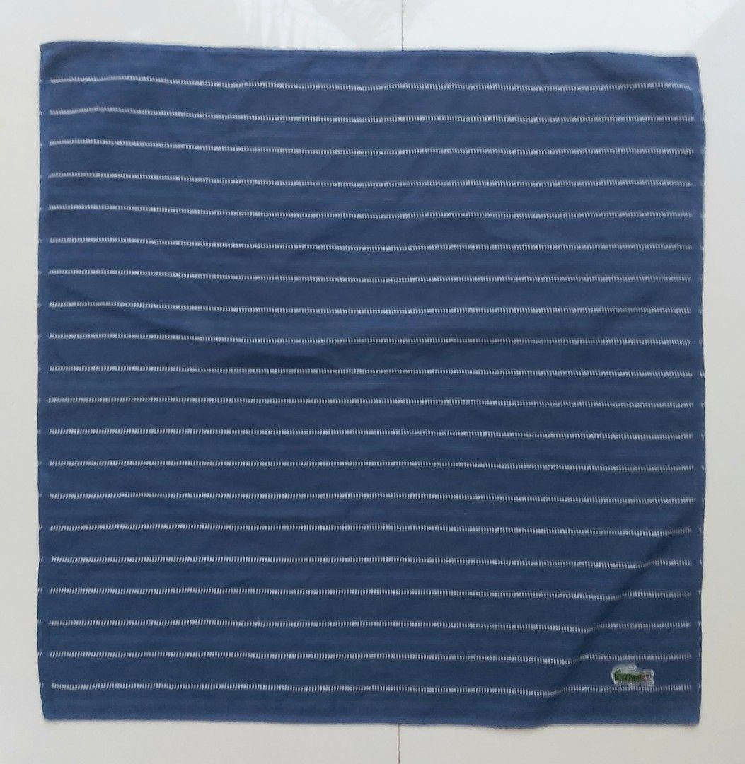 Lacoste Navy Blue Striped Handkerchief (Category: Handkerchief & Pocket Squares) located in Lapu Lapu. Submitted by agnesapm_29813 (Listing ID 1464259564, Image 2). Description: - Navy blue handkerchief with classic white stripes - Features the iconic embroidered Lacoste crocodile logo - Made from soft, comfortable cotton material - Perfect for everyday use or as a stylish accessory - Approximate dimensions: 17 inches x 17 inches - Washed and iro