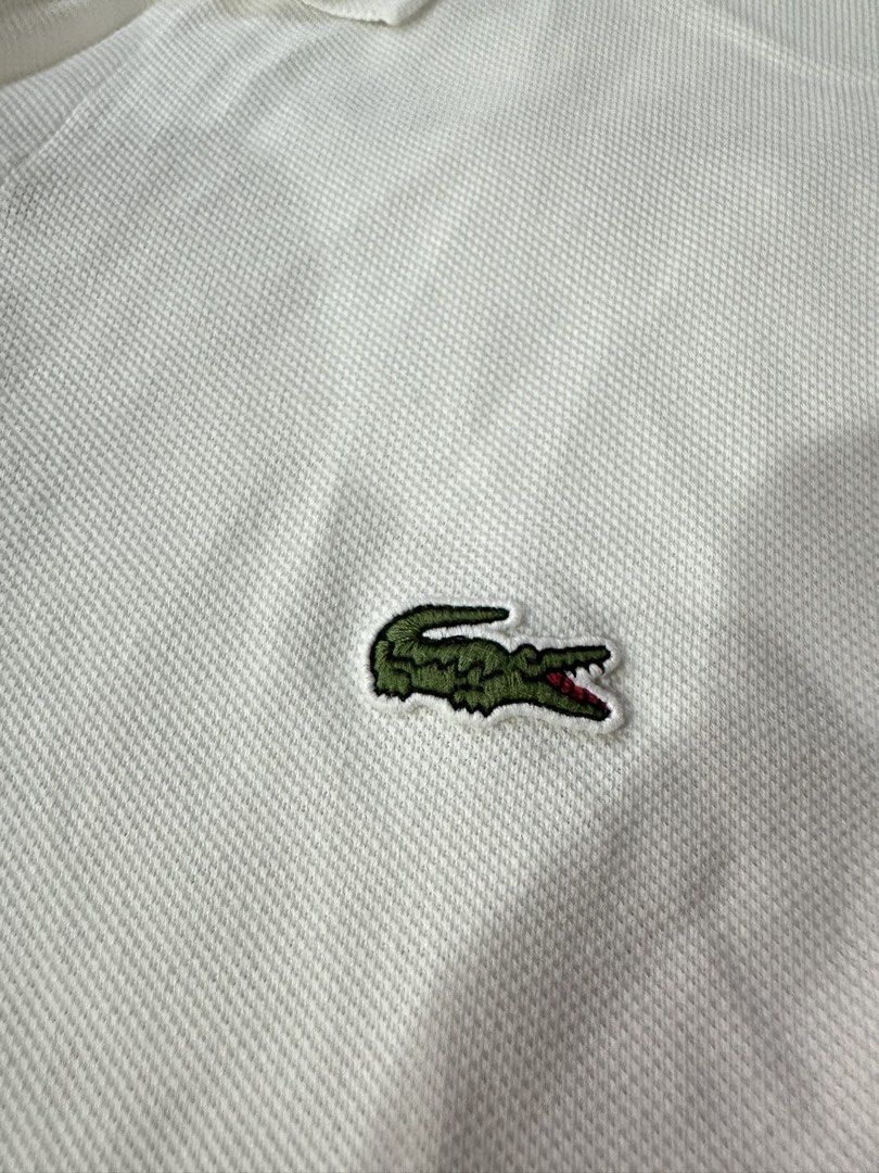 Lacoste Polo White (Category: Tshirts & Polo Shirts ) located in Butuan. Submitted by BytheriverClothing (Listing ID 1464241036, Image 3). Description: No issues Very good condition Color 9/10 Classic fit L26.5 W19 Small-Medium.
