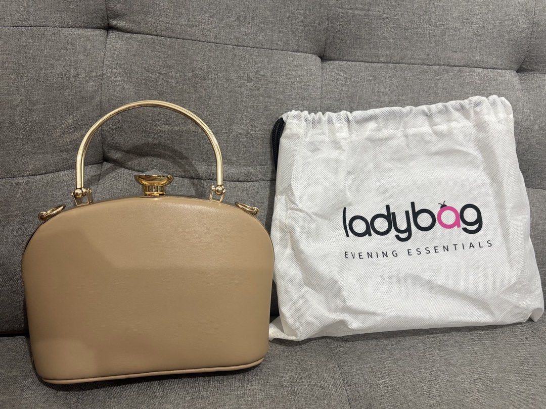 Ladybag Evening Essentials Clutch Bag with Handle (Category: Clutches) located in Pasay City. Submitted by keen.theesh_2026 (Listing ID 1464196843, Image 2). Description: - Beige clutch bag from Ladybag's Evening Essentials line. - Elegant gold handle. - Beautiful gem detail on top. - Comes with a protective dust bag. - Ideal for parties and formal events..