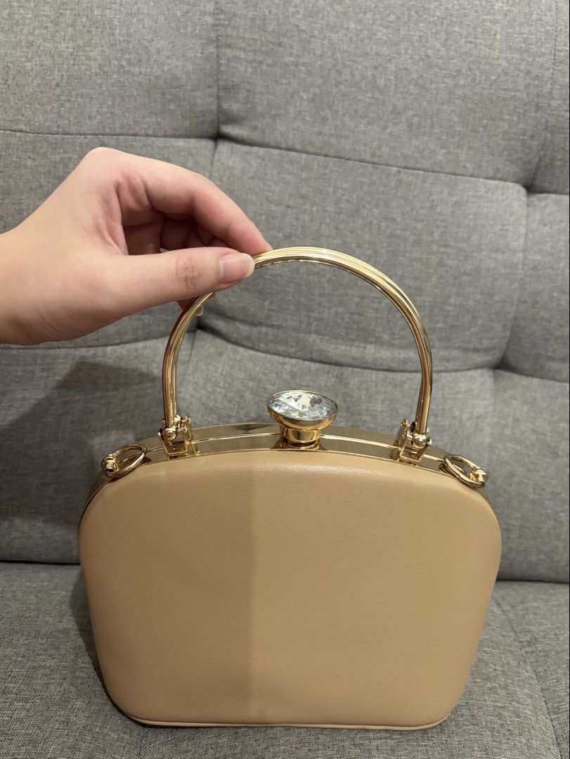 Ladybag Evening Essentials Clutch Bag with Handle (Category: Clutches) located in Pasay City. Submitted by keen.theesh_2026 (Listing ID 1464196843, Image 1). Description: - Beige clutch bag from Ladybag's Evening Essentials line. - Elegant gold handle. - Beautiful gem detail on top. - Comes with a protective dust bag. - Ideal for parties and formal events..