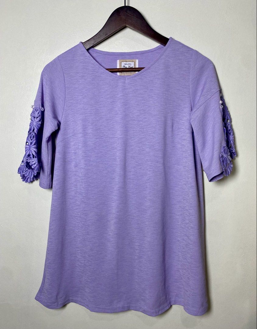 Lavender lace sleeve blouse (Category: Blouses) located in Makati City. Submitted by indaysukaycloset (Listing ID 1464221380, Image 1). Description: 💜 SALON, Pixie Heart TOKYO - Lavender Lace Sleeve Blouse Size S (Fits M to L) Brand: SALON, Pixie Heart EST 2010 TOKYO (Japan Brand) No: 23SQP-52 Size on tag: S Color: Lilac / Light Purple Details: - V-neck, 3/4 sleeves, A-line flowy fit - Crochet floral lace on both sleeves - With small faux pearl 