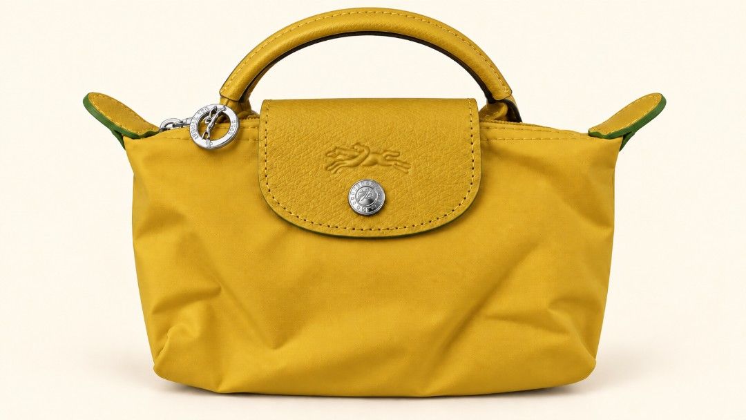 LC Mini Small Tote (Category: Purses & Pouches) located in Las Pinas. Submitted by Paninda.ph (Listing ID 1464342419, Image 2). Description: - Cute and compact LC mini tote bags - Ideal size for carrying your essentials - Made with durable nylon material - Features stylish leather trim - Secure zipper closure with a snap button flap - Perfect for everyday use and travel ***If you decide to buy 4 it be discounted price ***RFS - Impulsive buyer and