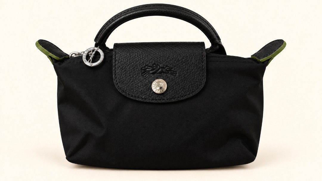 LC Mini Small Tote (Category: Purses & Pouches) located in Las Pinas. Submitted by Paninda.ph (Listing ID 1464342419, Image 3). Description: - Cute and compact LC mini tote bags - Ideal size for carrying your essentials - Made with durable nylon material - Features stylish leather trim - Secure zipper closure with a snap button flap - Perfect for everyday use and travel ***If you decide to buy 4 it be discounted price ***RFS - Impulsive buyer and