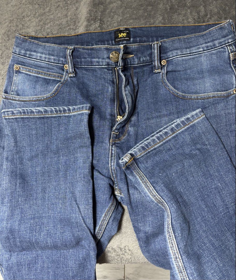 Lee Jeans Men's Size 32 Blue Denim (Category: Jeans) located in Pasig City. Submitted by genyzk (Listing ID 1464175984, Image 3). Description: - Classic blue denim jeans from Lee - Straight fit - Size 32 waist - Button and zip closure - Two back pockets with signature stitching - Leather Lee patch on back waistband - Perfect for everyday wear.