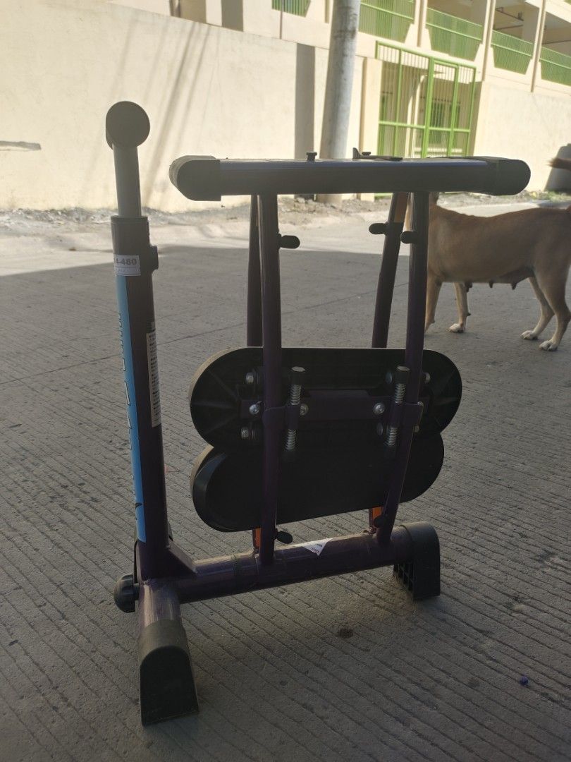 Leg Magic Exercise Machine (Category: Cardio & Fitness Machines) located in Manila. Submitted by torresrhea23040 (Listing ID 1464353172, Image 2). Description: - Leg Magic exercise machine - Purple frame with black footpads and grey handles - Folds for easy storage - Ideal for at-home leg workouts - Used but in good working condition - Ready for a new owner.