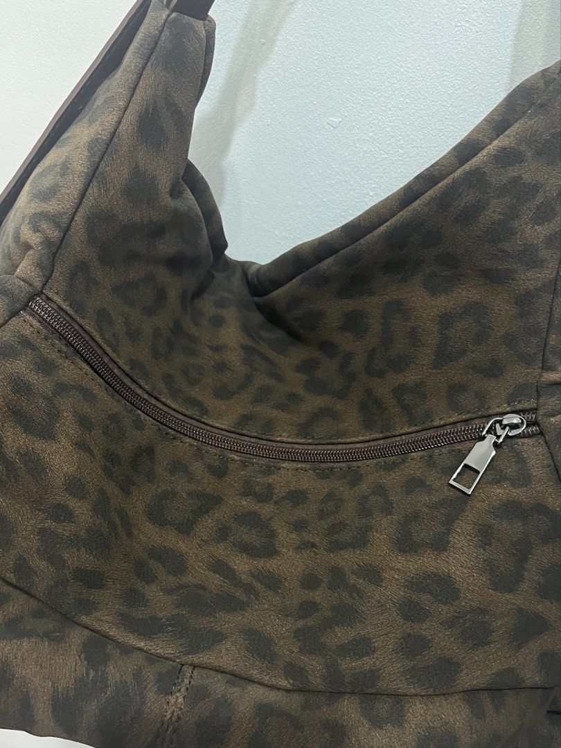 leopard print hobo bag (Category: Shoulder Bags) located in Caloocan City. Submitted by sarangh0ee (Listing ID 1464212989, Image 3). Description: - from bangkok - bnew with tag - super spacious! perfect as work bag - zipper opening is small but the inside is v big. can fit a lot of things :) .