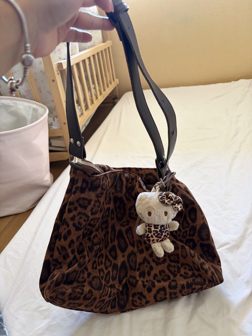 Leopard Print Shoulder Bag with Hello Kitty Charm (Category: Shoulder Bags) located in Taguig. Submitted by Shamieeee (Listing ID 1464322267, Image 1). Description: For pick up only My location is in taguig .