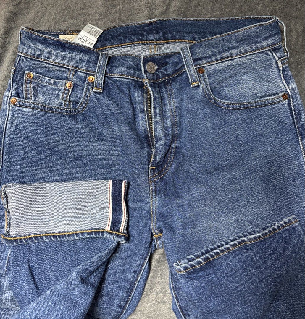 Levi's 502 Regular Taper Jeans W30 L30 (Category: Jeans) located in Pasig City. Submitted by genyzk (Listing ID 1464175662, Image 3). Description: - Brand: Levi's - Model: 502 - Fit: Regular Taper - Size: W30 L30 - Wash: Classic Blue - Features: Iconic red tab, leather patch, selvedge detail on cuffs - Ideal for: Everyday wear.