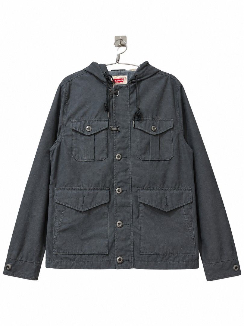 Levi's Hooded Utility Jacket (Category: Coats, Jackets and Outerwear) located in Lipa City. Submitted by gerardcala51660 (Listing ID 1464338607, Image 1). Description: Levi's Hooded Utility Jacket Small on tag Dimensions: 20.5 inches x 26 inches Excellent condition (thrifted) – Needs wash – Color may vary slightly due to lighting Excellent condition. Normal sign of usage at walang major flaws. Premium Levi's jacket in charcoal gray. Features a bu