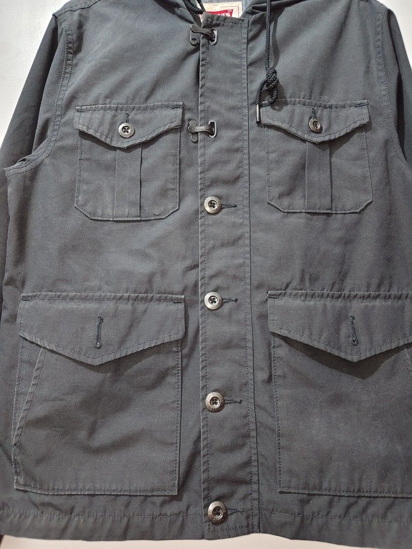 Levi's Hooded Utility Jacket (Category: Coats, Jackets and Outerwear) located in Lipa City. Submitted by gerardcala51660 (Listing ID 1464338607, Image 2). Description: Levi's Hooded Utility Jacket Small on tag Dimensions: 20.5 inches x 26 inches Excellent condition (thrifted) – Needs wash – Color may vary slightly due to lighting Excellent condition. Normal sign of usage at walang major flaws. Premium Levi's jacket in charcoal gray. Features a bu
