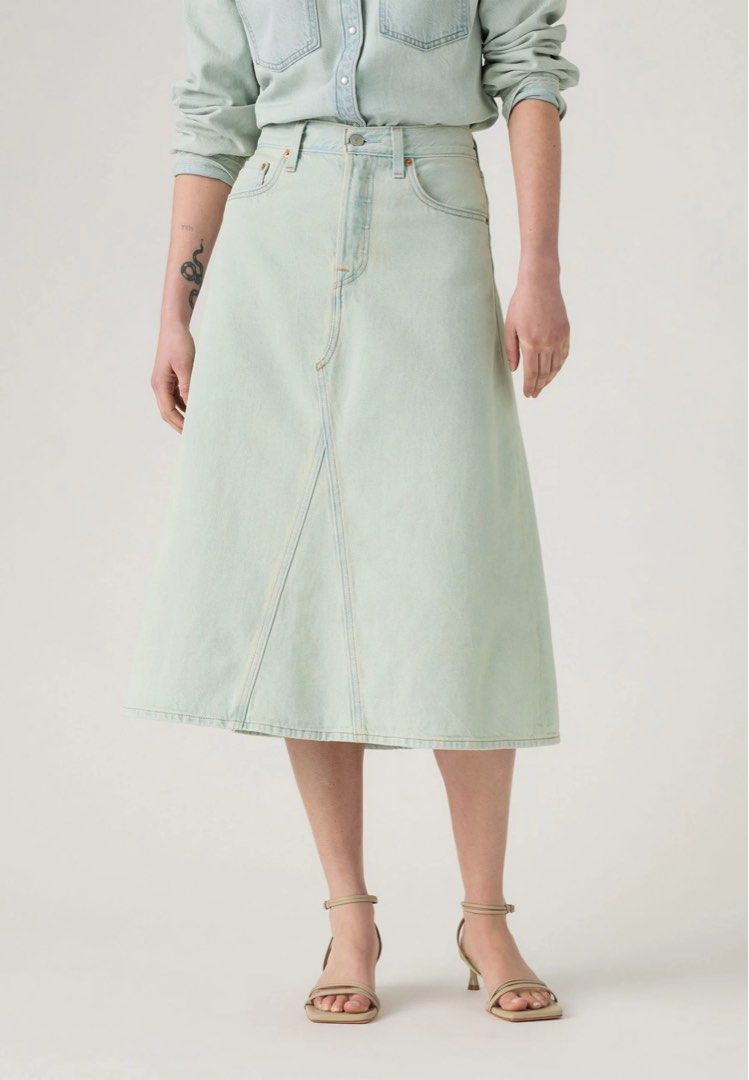Levi's Skirt (Category: Skirts) located in Manila. Submitted by mamasavsavi (Listing ID 1464311456, Image 1). Description: - Classic Levi's denim midi skirt - Light, washed-out blue color - Flattering A-line cut - Front seam detail - Functional pockets - Versatile for casual outfits - Pairs well with tees and blouses Orig price 3900 BRANDNEW WITH TAG WITH PAPER BAG Bought at Levis store SIZE 25 on tag SUPER GANDA kaso maluwag sa akin .
