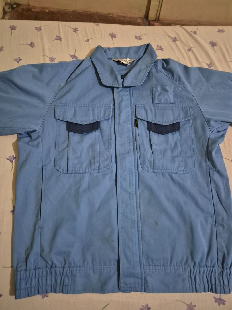 Light Blue Work Jacket (Category: Coats, Jackets and Outerwear) located in Caloocan City. Submitted by lecitoyen2026 (Listing ID 1464184875, Image 1). Description: - Light blue work jacket - Two dark blue chest pockets with button closure - Elasticated waistband and cuffs - Suitable for work or casual wear.