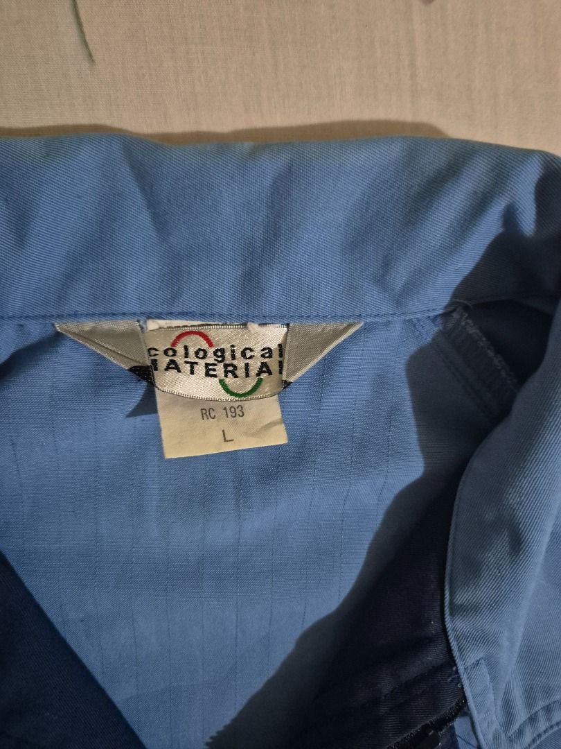 Light Blue Work Jacket (Category: Coats, Jackets and Outerwear) located in Caloocan City. Submitted by lecitoyen2026 (Listing ID 1464184875, Image 2). Description: - Light blue work jacket - Two dark blue chest pockets with button closure - Elasticated waistband and cuffs - Suitable for work or casual wear.