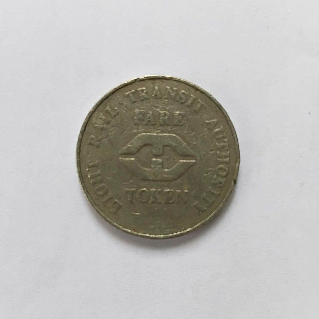 Light Rail Transit Fare Authority Token (Category: Currency) located in Bacoor. Submitted by hazirannei (Listing ID 1464269825, Image 1). Description: - Authentic token from the Light Rail Transit Fare Authority. - Inscribed with 'RAIL TRANSIT FARE AUTHORITY' and 'LIGHT TOKEN'. - Features a stylized logo in the center. - Ideal for collectors of transit memorabilia. - A unique piece of Philippine transportation history. RfS: Decluttering MoP: GCas