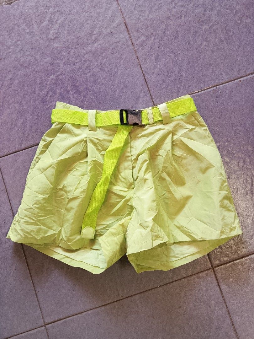 Lime Green Belted Pleated Shorts (Category: Shorts) located in Manila. Submitted by arjaygoodfind (Listing ID 1464190336, Image 1). Description: - Adorable lime green shorts - Features front pleats for a stylish look - Comes with a matching belt and buckle - Belt size tag indicates '40 S' - Ideal for creating a casual and chic outfit.