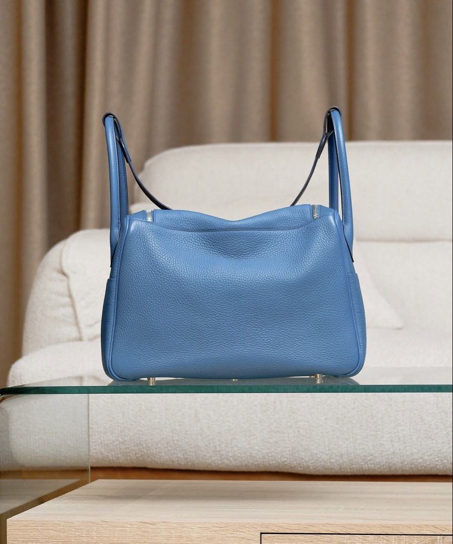 Lindy 34 bicolor (Category: Luxury Bags & Wallets) located in Makati City. Submitted by dgcurated09 (Listing ID 1464306976, Image 3). Description: - Authentic Hermes Lindy bag Stamp R - Color: Blue Colvert/blue sapphire - Material: Leather - Hardware: palladium - Features: Top handles, shoulder strap, interior pockets - Includes: Dustbag - Ideal for: Everyday use.