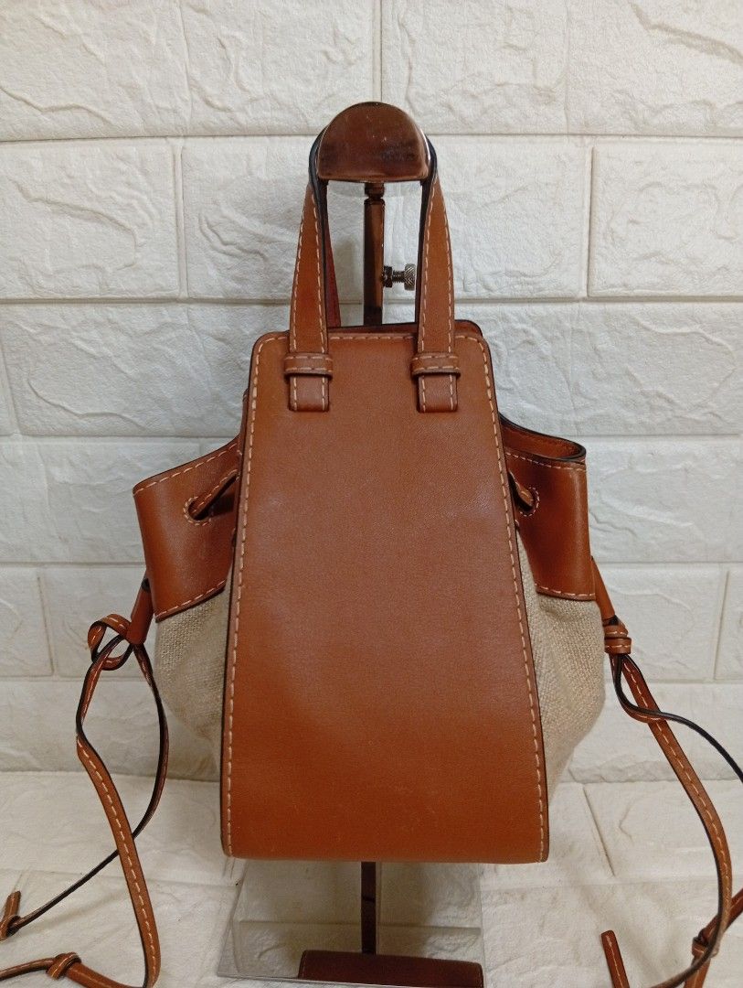 Loewe Small Mini Hammock Drawstring Bag Tan Leather Canvas (Category: Shoulder Bags) located in Las Pinas. Submitted by etoksi1234 (Listing ID 1464200298, Image 2). Description: Pre-loved Loewe Mini Hammock Drawstring Bag, showcasing tan calfskin leather contrasted with natural canvas side panels and an embossed Anagram logo..