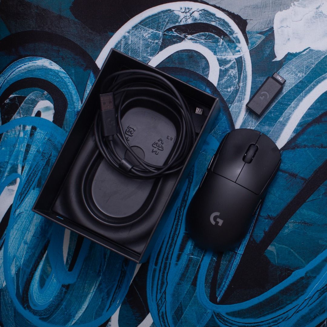 Logitech G PRO Wireless Gaming Mouse (Category: Mouse & Mousepads) located in Quezon City. Submitted by stableshutterstudios (Listing ID 1464211801, Image 2). Description: Includes original box, charging cable, and USB receiver extension adapter. .. Condition notes: Double clicks from time to time. Missing top right side button. Mouse skates/feet need replacement Cosmetically clean with minor surface wear from normal use. Sensor and scroll wheel 