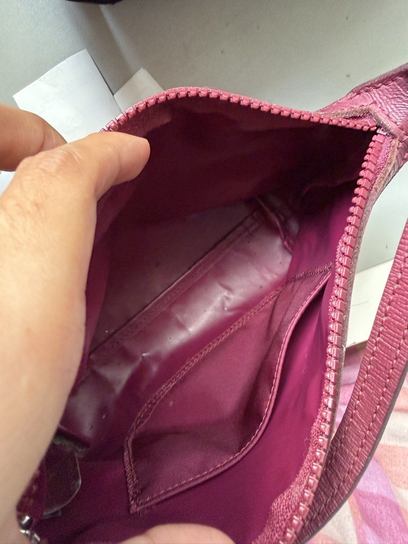 Longchamp Burgundy Nylon Pouch Bag (Category: Luxury Bags & Wallets) located in Paranaque City. Submitted by ferrewr (Listing ID 1464195512, Image 3). Description: - Burgundy Longchamp nylon pouch - Features leather trim and strap - Secure zipper closure - Interior pocket for small items - Minor marks on exterior fabric - Ideal for bag organization or as a standalone clutch.