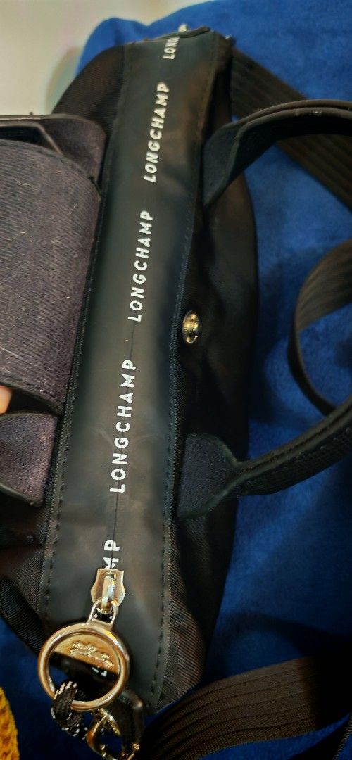Longchamp Le Pliage Neo Small Top Handle Bag Black (Category: Luxury Bags & Wallets) located in Caloocan City. Submitted by miyaka_lm (Listing ID 1464202529, Image 2). Description: - Black Longchamp - Small size, ideal for daily use - Versatile: Top handles and detachable shoulder strap - Secure zipper closure - Made in France - Signature Longchamp logo details on snap button and zipper pull - Brand name printed along zipper trim.