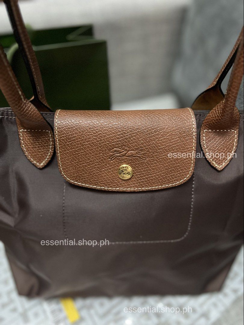 Longchamp Le Pliage Original Medium Long Handle in Mocha (Category: Luxury Bags & Wallets) located in Manila. Submitted by essential.shop.ph (Listing ID 1464210390, Image 2). Description: FOR PRE-ORDER. 7-10 days ETA ☺️ Authentic Longchamp Le Pliage Original Medium Long Handle Mocha (Actual color difficult to capture. Changes due to lighting.) Includes care card, LGP zip lock pouch and paper bag. Dimensions 28 cm (L - measured at the base of the 