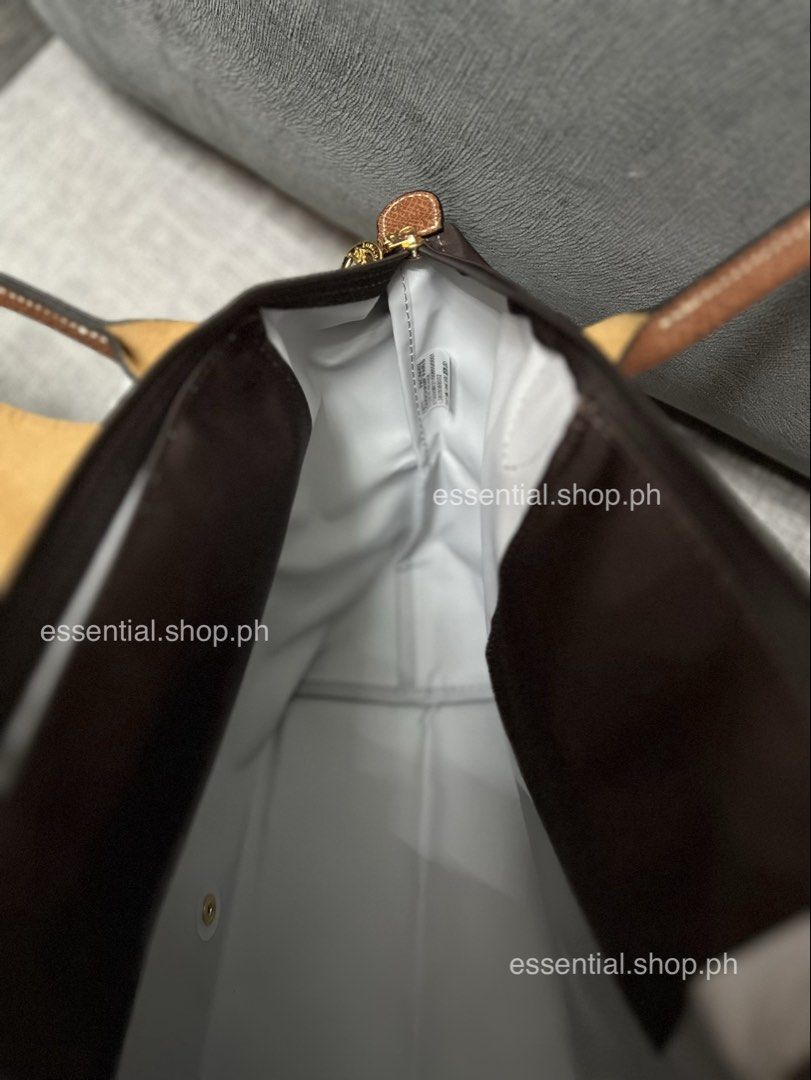 Longchamp Le Pliage Original Medium Long Handle in Mocha (Category: Luxury Bags & Wallets) located in Manila. Submitted by essential.shop.ph (Listing ID 1464210390, Image 3). Description: FOR PRE-ORDER. 7-10 days ETA ☺️ Authentic Longchamp Le Pliage Original Medium Long Handle Mocha (Actual color difficult to capture. Changes due to lighting.) Includes care card, LGP zip lock pouch and paper bag. Dimensions 28 cm (L - measured at the base of the 