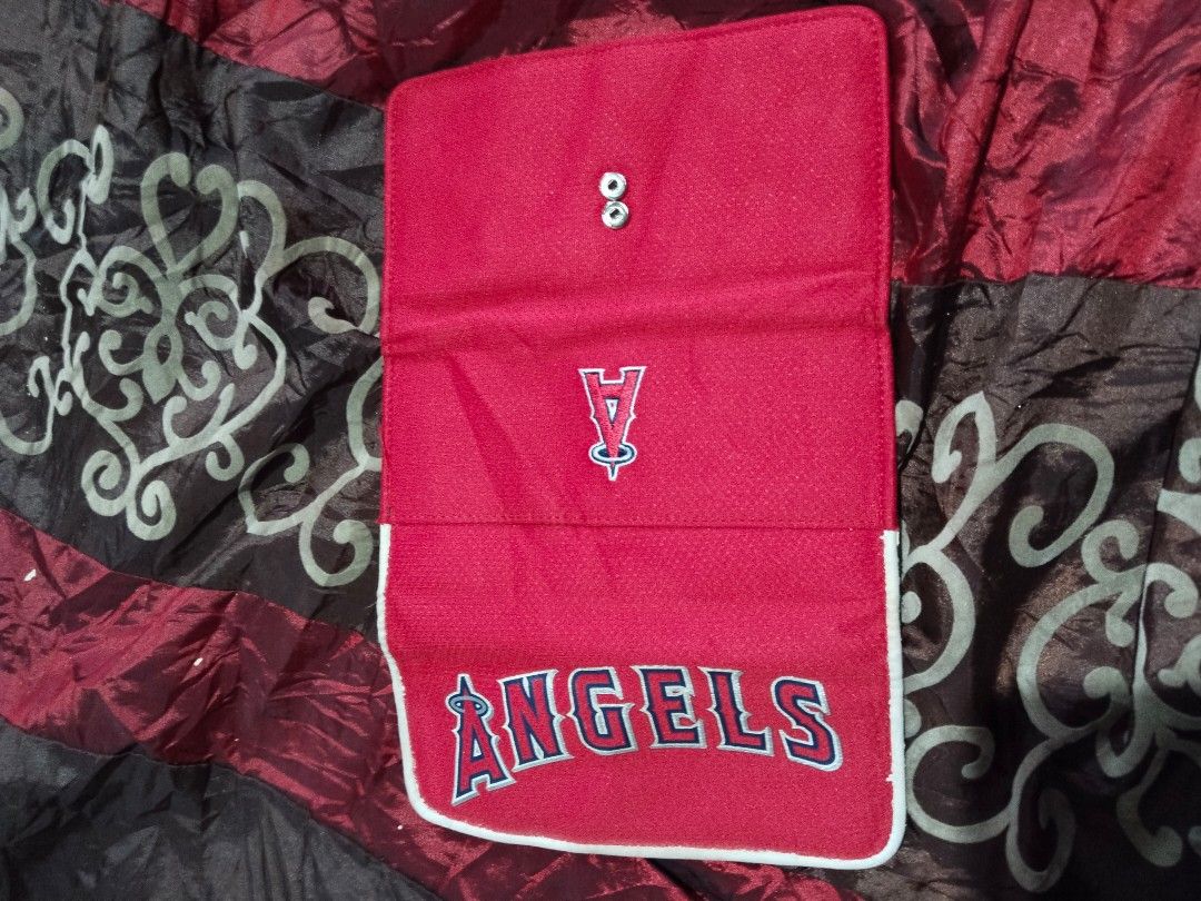 Los Angeles Angels Trifold Wallet (Category: Wallets & Card Holders) located in Mabalacat. Submitted by al_amin_thrift (Listing ID 1464254541, Image 3). Description: Los Angeles Angels MLB Official Trifold Wallet Officially Licensed: Genuine MLB Merchandise — MVF (Most Valuable Fan) by Littlearth Design & Details: - Front: Bold embroidered "ANGELS" lettering + iconic halo "A" logo ​ - Back: Small embroidered Angels "A" emblem ​ - Material: Durabl