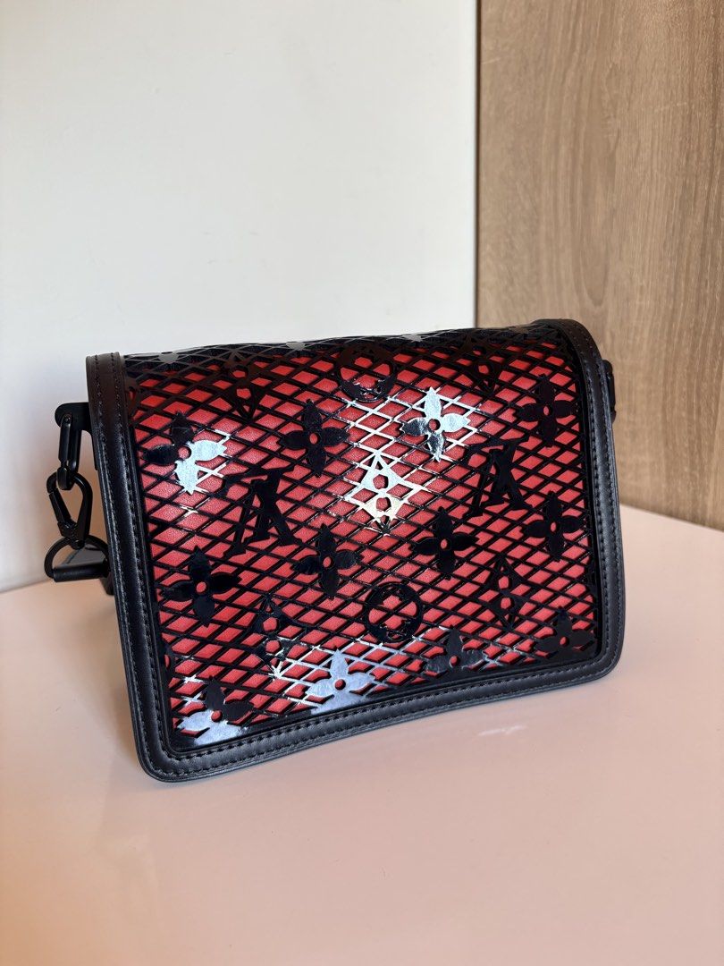 Louis Vuitton Monogram Mesh Crossbody Bag Red Black (Category: Luxury Bags & Wallets) located in Taal. Submitted by aliafrncsca (Listing ID 1464163848, Image 2). Description: - Authentic Louis Vuitton crossbody bag - Iconic monogram pattern in a unique mesh design - Red interior with black leather trim and hardware - Comes with dust bag and authenticity cards - Ideal for nights out or as a statement accessory.