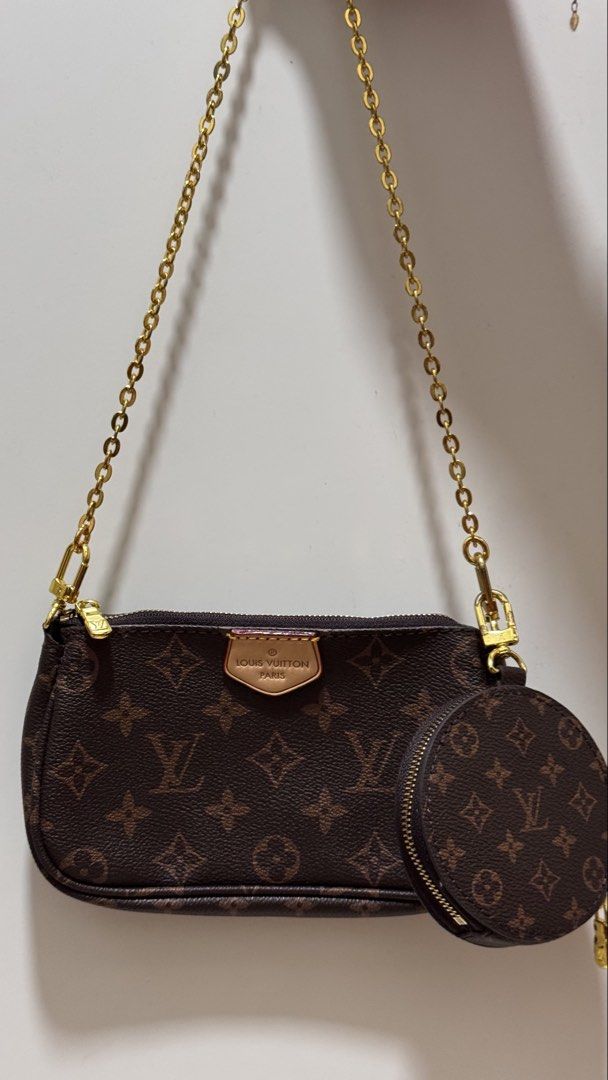 Louis Vuitton Monogram Pouch and Coin Purse Set (Category: Luxury Bags & Wallets) located in Pasig City. Submitted by sdpii (Listing ID 1464234112, Image 3). Description: - Louis Vuitton monogram pouch and round coin purse set. - Features classic monogram canvas and durable material. - Both pieces come with elegant gold hardware. - Includes a stylish chain strap for easy carrying. - Pouch is long and slim, ideal for essentials. - Coin purse is ci