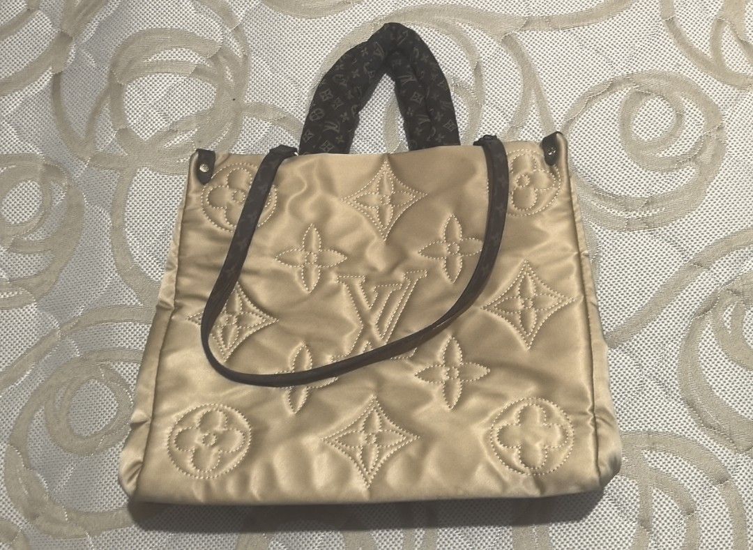Louis Vuitton Monogram Puffy Tote Bag (Category: Luxury Bags & Wallets) located in Abucay. Submitted by jerlynbal98316 (Listing ID 1464150324, Image 2). Description: - Stylish beige puffy tote bag - Iconic Louis Vuitton monogram pattern - Comfortable top handles and detachable shoulder strap - Ideal for everyday use - Spacious interior for all your essentials.