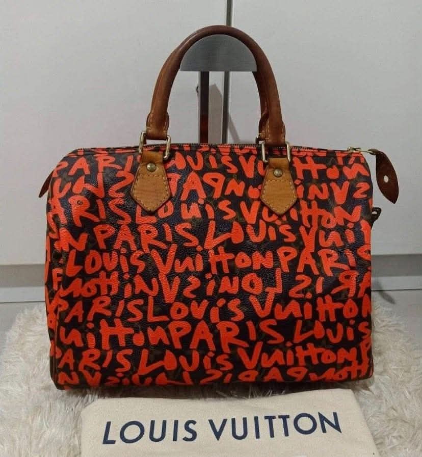 Louis Vuitton x Stephen Sprouse Speedy 30 Monogram Graffiti Bag (Category: Luxury Bags & Wallets) located in Manila. Submitted by rufus_apparel (Listing ID 1464301565, Image 1). Description: - Authentic Louis Vuitton Speedy 30 - Iconic Monogram Graffiti print (orange/black) - Leather handles and trim - Zipper closure with lock and keys - Date code: AA0049 - Rare find for collectors - Japan - Money-back if not AUTHENTIC.