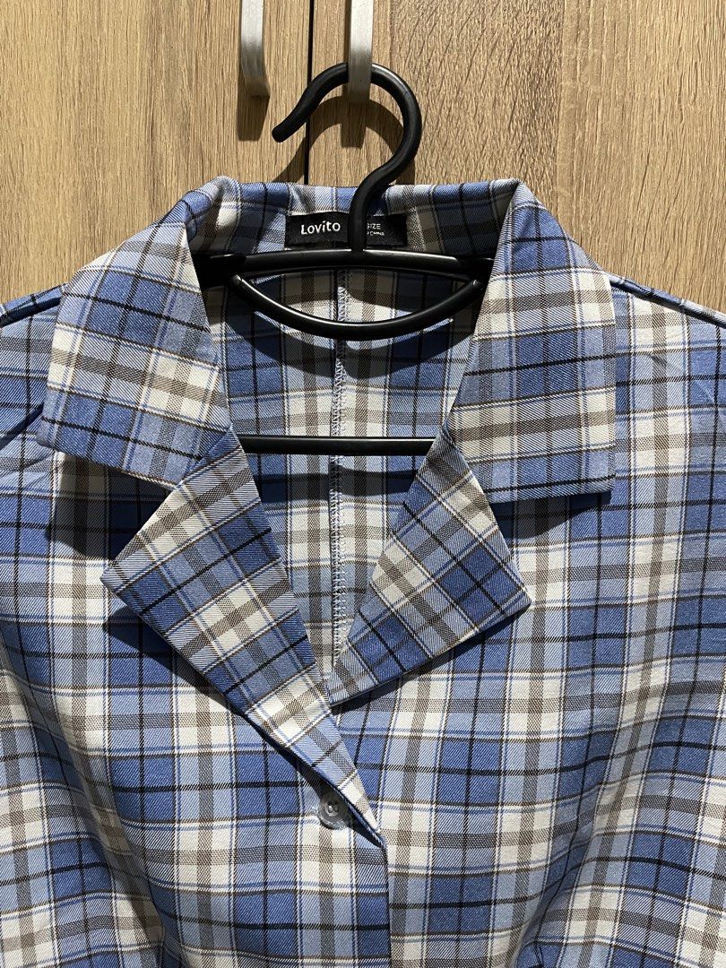 Lovito Blue Plaid Cropped Button-Up Shirt (Category: Longsleeves) located in Manila. Submitted by preloveditems_jem (Listing ID 1464302229, Image 2). Description: Cute blue plaid cropped shirt from Lovito. Short sleeves with a collared neckline. Button-up front. Looks great paired with high-waisted bottoms. Perfect for a casual day out or a stylish layered look..