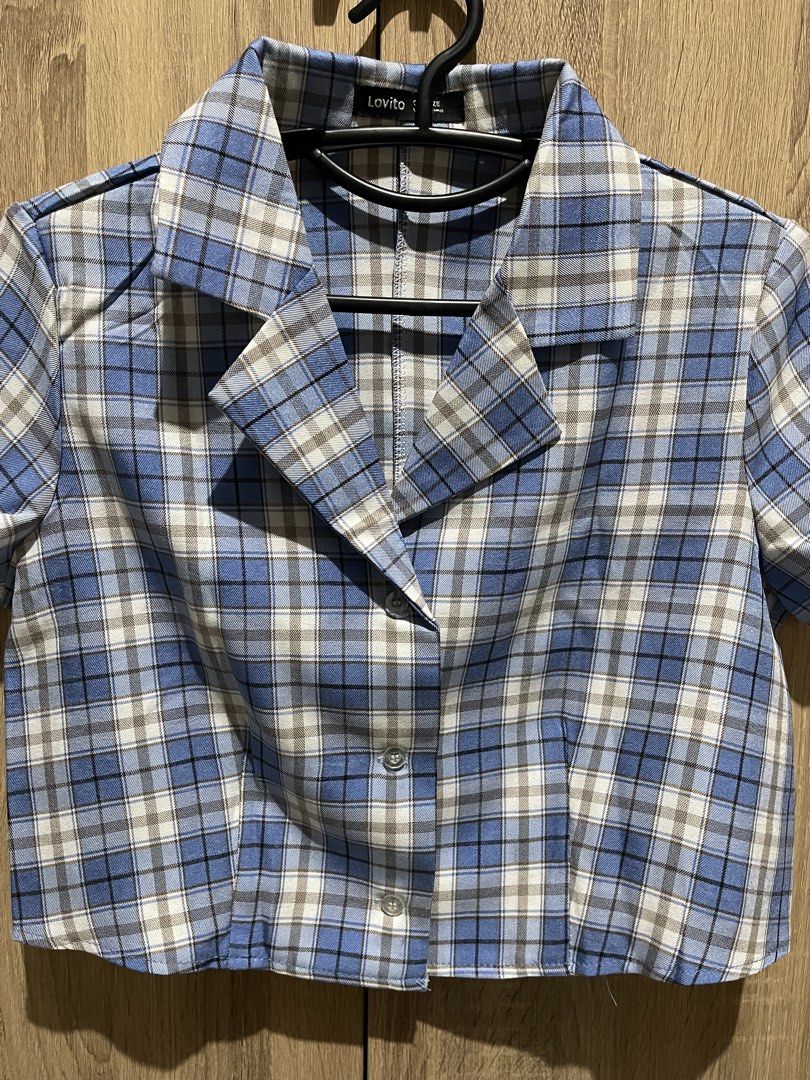 Lovito Blue Plaid Cropped Button-Up Shirt (Category: Longsleeves) located in Manila. Submitted by preloveditems_jem (Listing ID 1464302229, Image 3). Description: Cute blue plaid cropped shirt from Lovito. Short sleeves with a collared neckline. Button-up front. Looks great paired with high-waisted bottoms. Perfect for a casual day out or a stylish layered look..