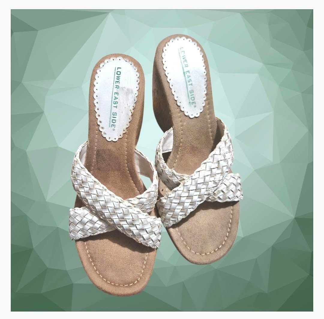 Lower East Side Wedge Slip on (Category: Sandals) located in Paranaque City. Submitted by calm_youngstore7 (Listing ID 1464320824, Image 2). Description: PRICE DROP! LAST PIECESALE! Lower East Side White Braided Slide Wedge heels These iconic slip-on mules showcase a characteristic silhouette with cross-over woven straps, a cushioned tan faux-suede footbed, and a high, lightweight faux-cork platform wedge heel. Size 5 and 6.