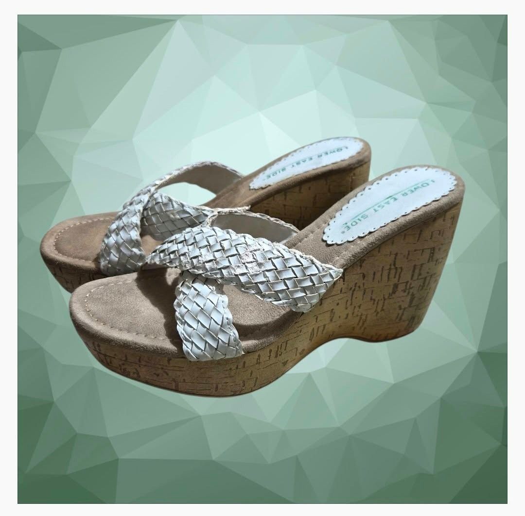 Lower East Side Wedge Slip on (Category: Sandals) located in Paranaque City. Submitted by calm_youngstore7 (Listing ID 1464320824, Image 1). Description: PRICE DROP! LAST PIECESALE! Lower East Side White Braided Slide Wedge heels These iconic slip-on mules showcase a characteristic silhouette with cross-over woven straps, a cushioned tan faux-suede footbed, and a high, lightweight faux-cork platform wedge heel. Size 5 and 6.