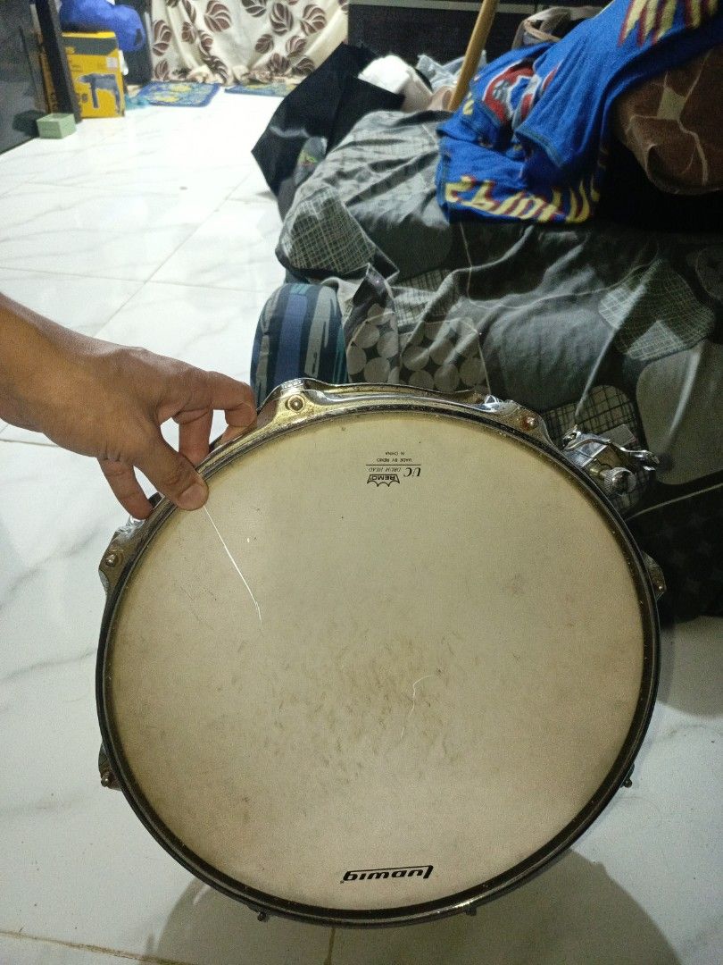 Ludwig Snare Drum (Category: Musical Instruments) located in Manila. Submitted by kibous29 (Listing ID 1464209357, Image 1). Description: - Classic Ludwig snare drum - Eye-catching red sparkle finish - Batter head shows some marks, but snare wires are intact - Perfect for practice or performance.