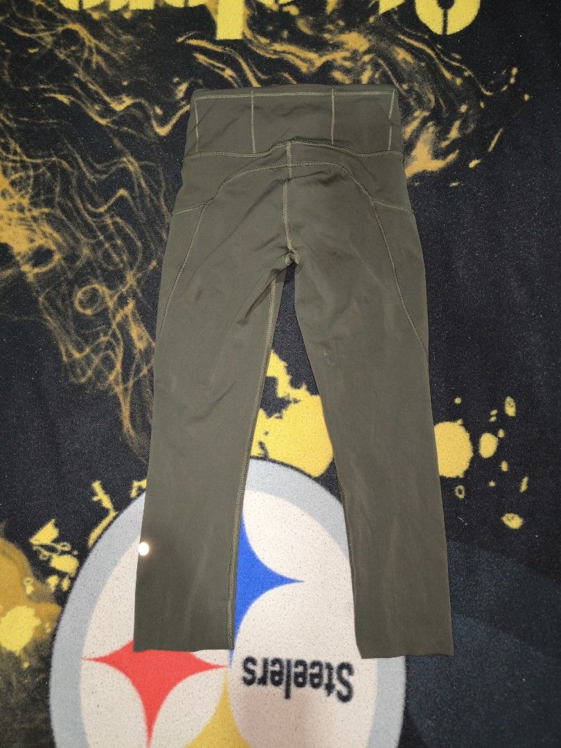 Lululemon Align Crop Leggings (Category: Activewear) located in Manila. Submitted by fljaoti27 (Listing ID 1464258334, Image 2). Description: - Lululemon Align Crop Leggings - Color: Olive Green - Size: 2 - Features: Side pockets, reflective details on calves - Material: Comfortable and stretchy - Ideal for: Workouts, everyday wear.