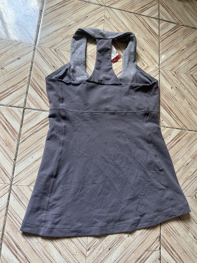 Lululemon Grey Racerback Tank Top Size 6 (Category: Activewear) located in Angeles City. Submitted by alejeong27 (Listing ID 1464163562, Image 2). Description: - Grey Lululemon Racerback Tank Top - Contrasting grey neckline and straps - Built-in bra support - Ideal for workouts or casual wear - Size: 6.