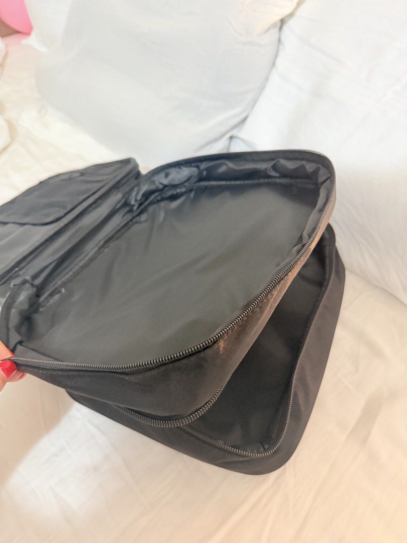 MAC Black Makeup Bag Organizer (Category: Purses & Pouches) located in Manila. Submitted by mengxir20193848 (Listing ID 1464192253, Image 3). Description: - Black MAC makeup bag - Multiple interior compartments for organization - Secure zip closure - Ideal for travel or everyday use - Clean inside and out - Ready for a new home.