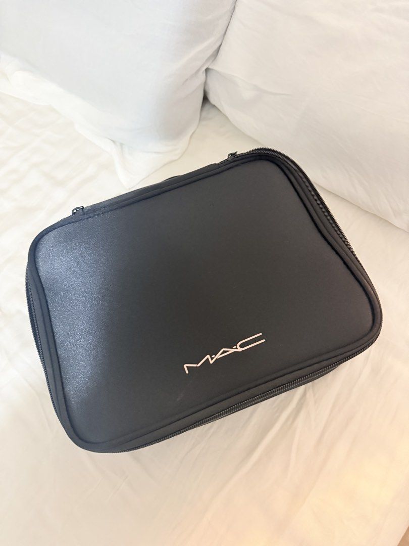 MAC Black Makeup Bag Organizer (Category: Purses & Pouches) located in Manila. Submitted by mengxir20193848 (Listing ID 1464192253, Image 1). Description: - Black MAC makeup bag - Multiple interior compartments for organization - Secure zip closure - Ideal for travel or everyday use - Clean inside and out - Ready for a new home.