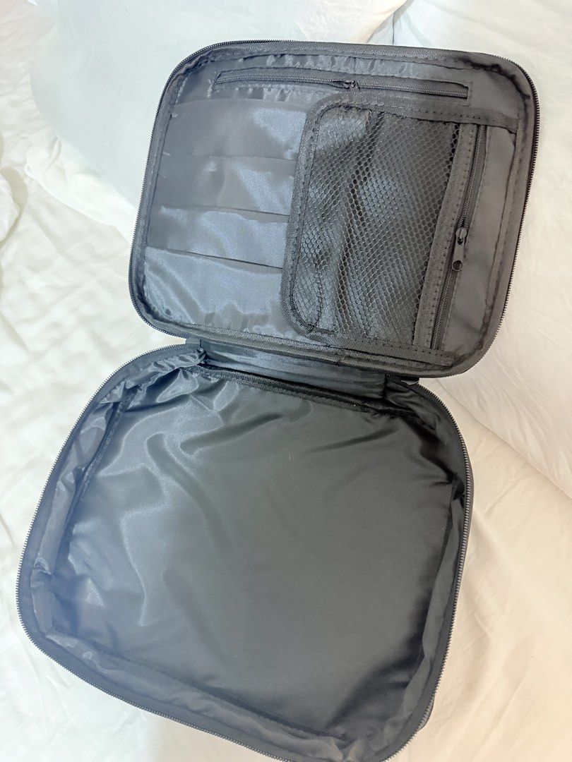 MAC Black Makeup Bag Organizer (Category: Purses & Pouches) located in Manila. Submitted by mengxir20193848 (Listing ID 1464192253, Image 2). Description: - Black MAC makeup bag - Multiple interior compartments for organization - Secure zip closure - Ideal for travel or everyday use - Clean inside and out - Ready for a new home.