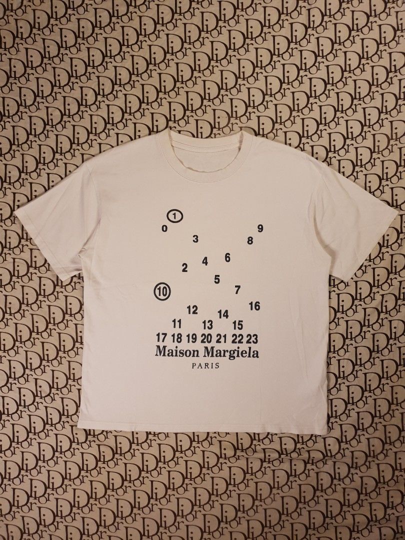 Maison Margiela (Category: Tshirts & Polo Shirts ) located in San Fernando. Submitted by retro.district. (Listing ID 1464192766, Image 1). Description: - Maison Margiela numbers design - Size: Large - Condition: Excellent - issue cut necktag.
